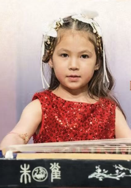 Xiao Bao, youngest performer, age 8